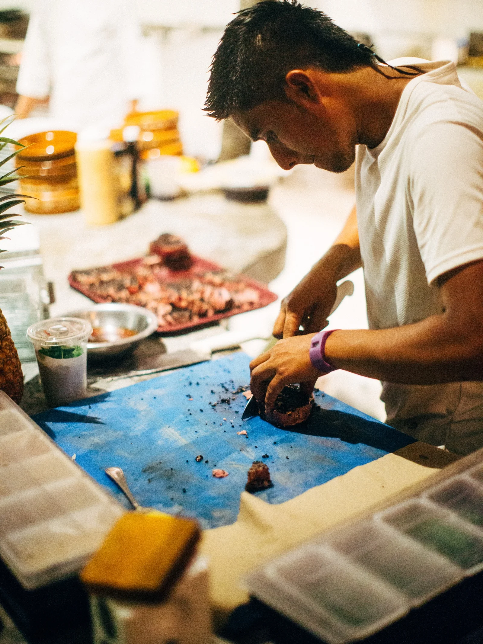A cook at work in a warm kitchen