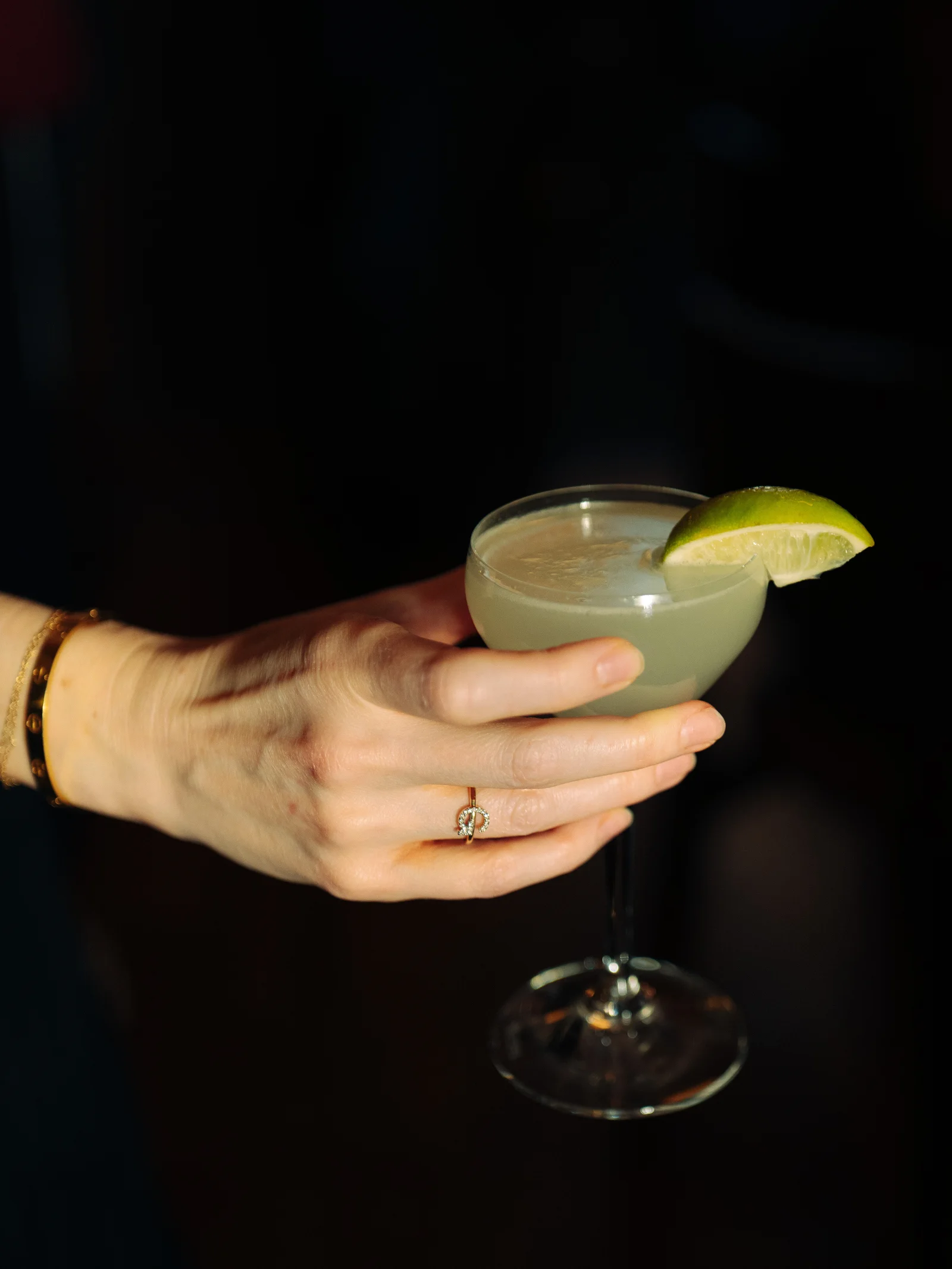 A cocktail held in a hand